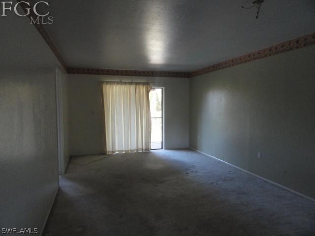 1231 Barrett Road, Unit 1004 North Fort Myers, FL 33903 - Photo 4 of 12 a view of an empty room with a window
