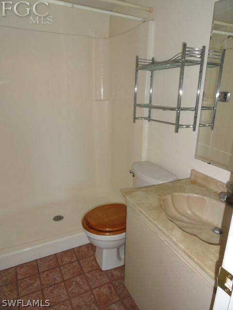 1231 Barrett Road, Unit 1004 North Fort Myers, FL 33903 - Photo 5 of 12 a bathroom with a sink and a toilet