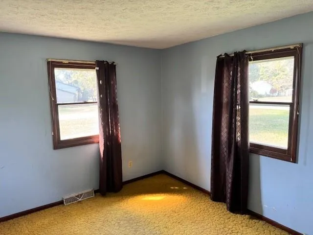 a view of an empty room and window