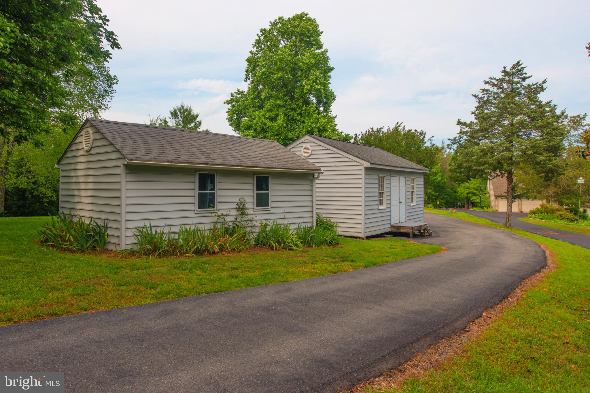 737 Plum Tree Road Bumpass, VA 23024 - Photo 43 of 46 Paved driveway storage sheds