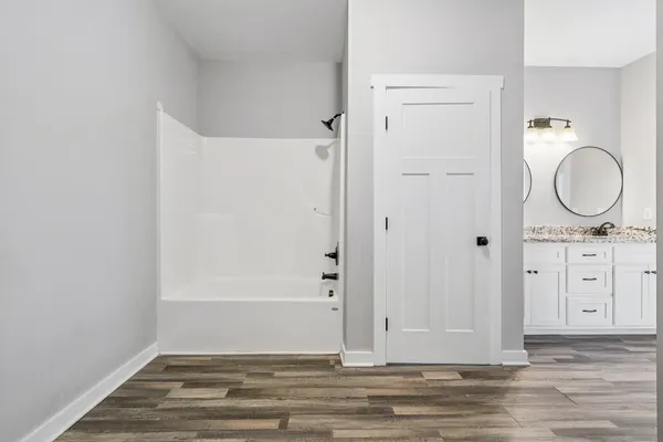 a view of a bathroom with sink and mirror