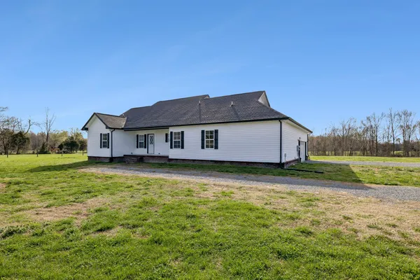 a outdoor view of a house with a yard