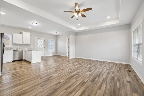 a view of kitchen with wooden floor and window