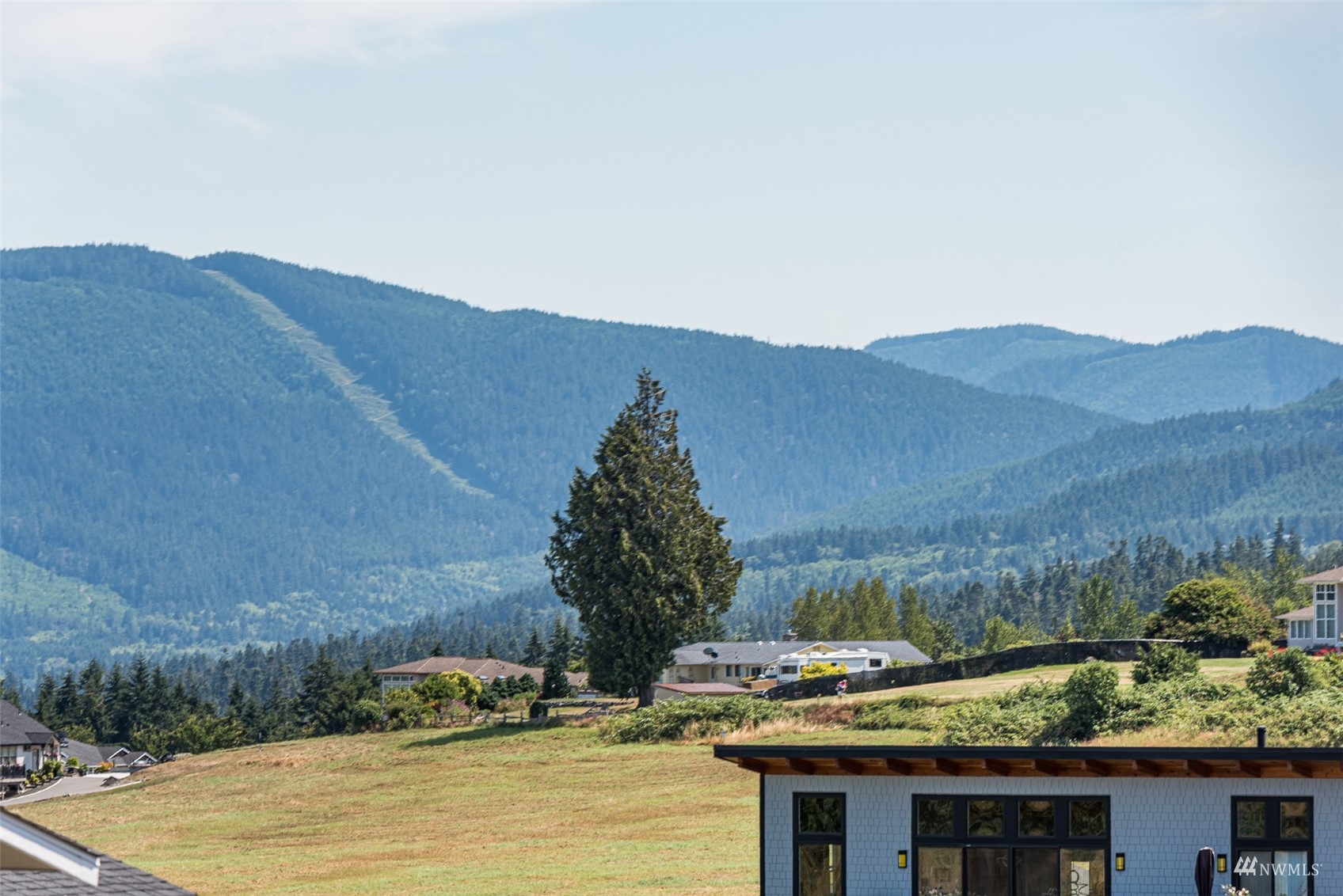 411 Jones Farm Road Sequim, WA 98382 - Photo 12 of 40 a view of a house with a yard and mountain view
