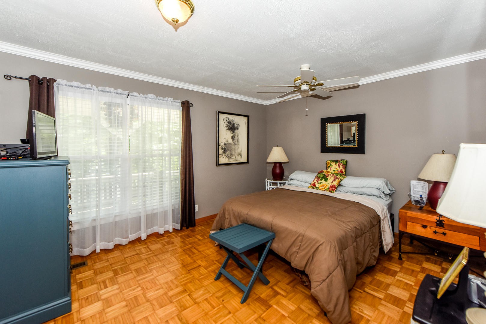 297 Lester Whitt Road Rutledge, TN 37861 - Photo 14 of 27 a bedroom with a bed and a chandelier