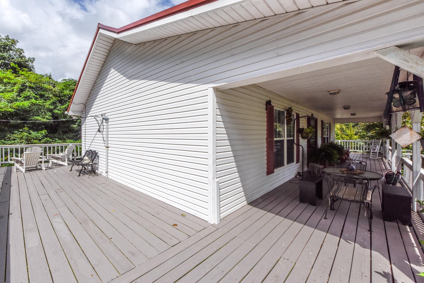 297 Lester Whitt Road Rutledge, TN 37861 - Photo 4 of 27 a view of a patio with table and chairs and wooden floor