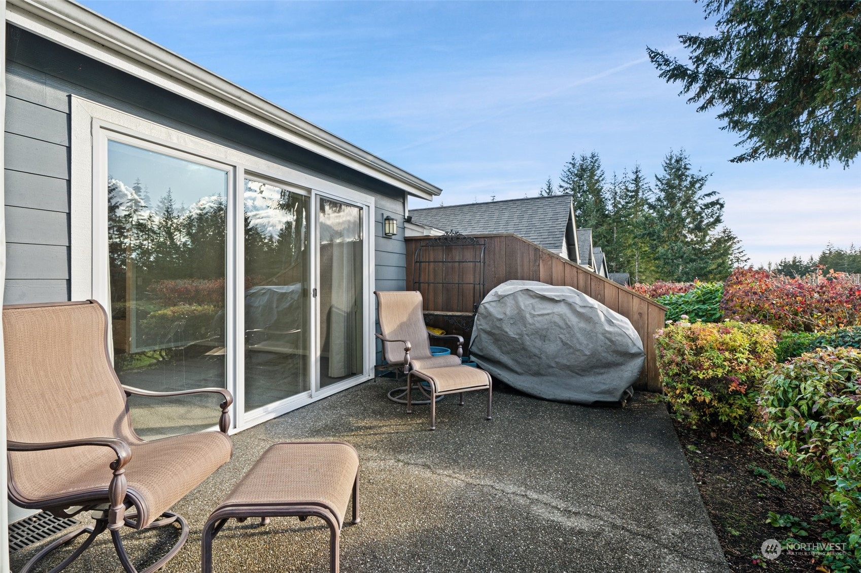 160 East Soderberg Road, Unit G18 Allyn, WA 98524 - Photo 17 of 36 a view of a patio with table and chairs and potted plants