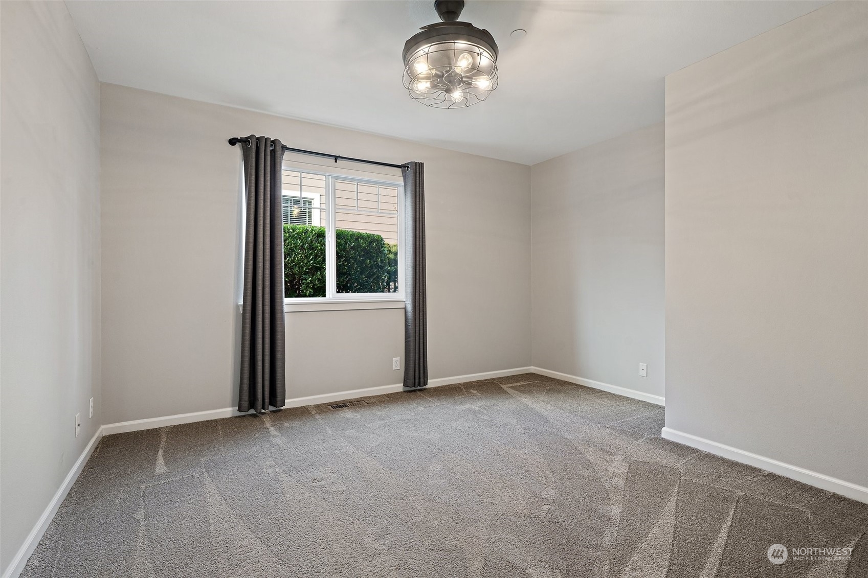 160 East Soderberg Road, Unit G18 Allyn, WA 98524 - Photo 23 of 36 an empty room with chandelier fan