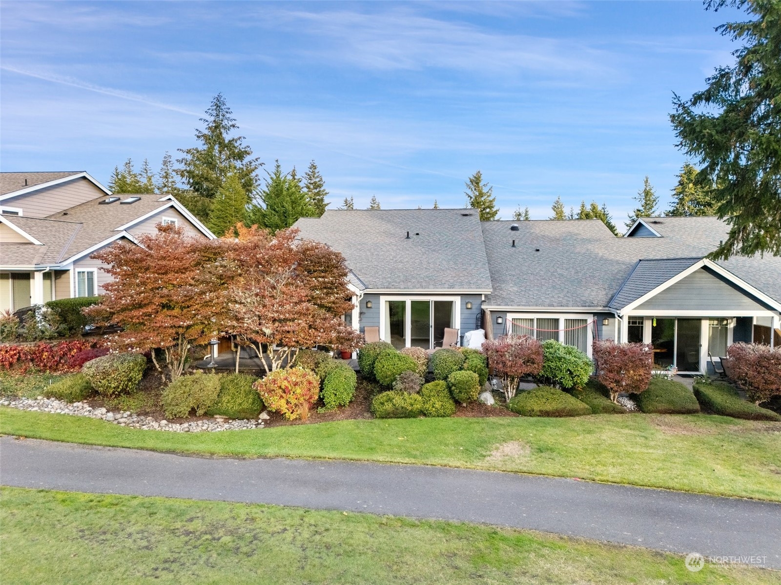 160 East Soderberg Road, Unit G18 Allyn, WA 98524 - Photo 30 of 36 front view of a house with a yard