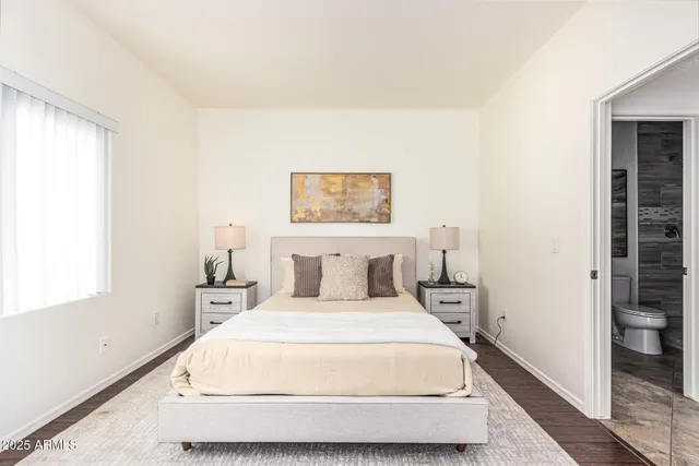 a large bed in a white room