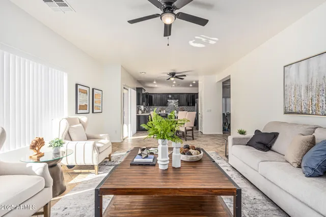 a bedroom with a bed and closet with mirror