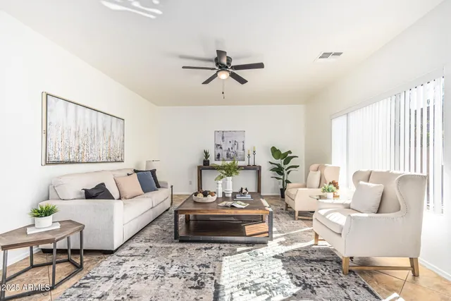 a living room with furniture and a rug