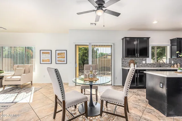a view of a dining room with furniture wooden floor and chandelier