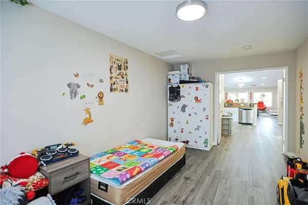 a living room with furniture and a book shelf