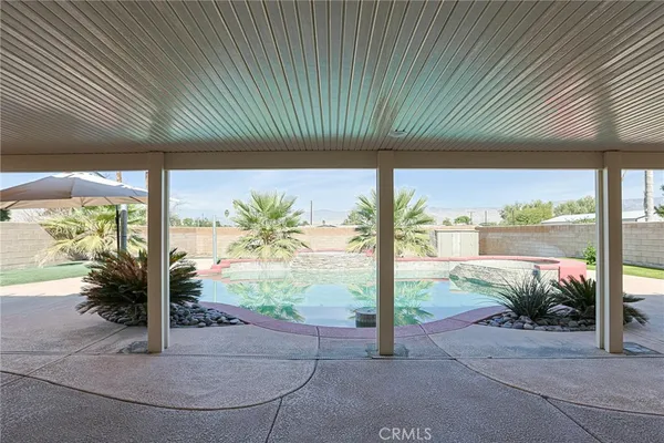 a porch with a garden