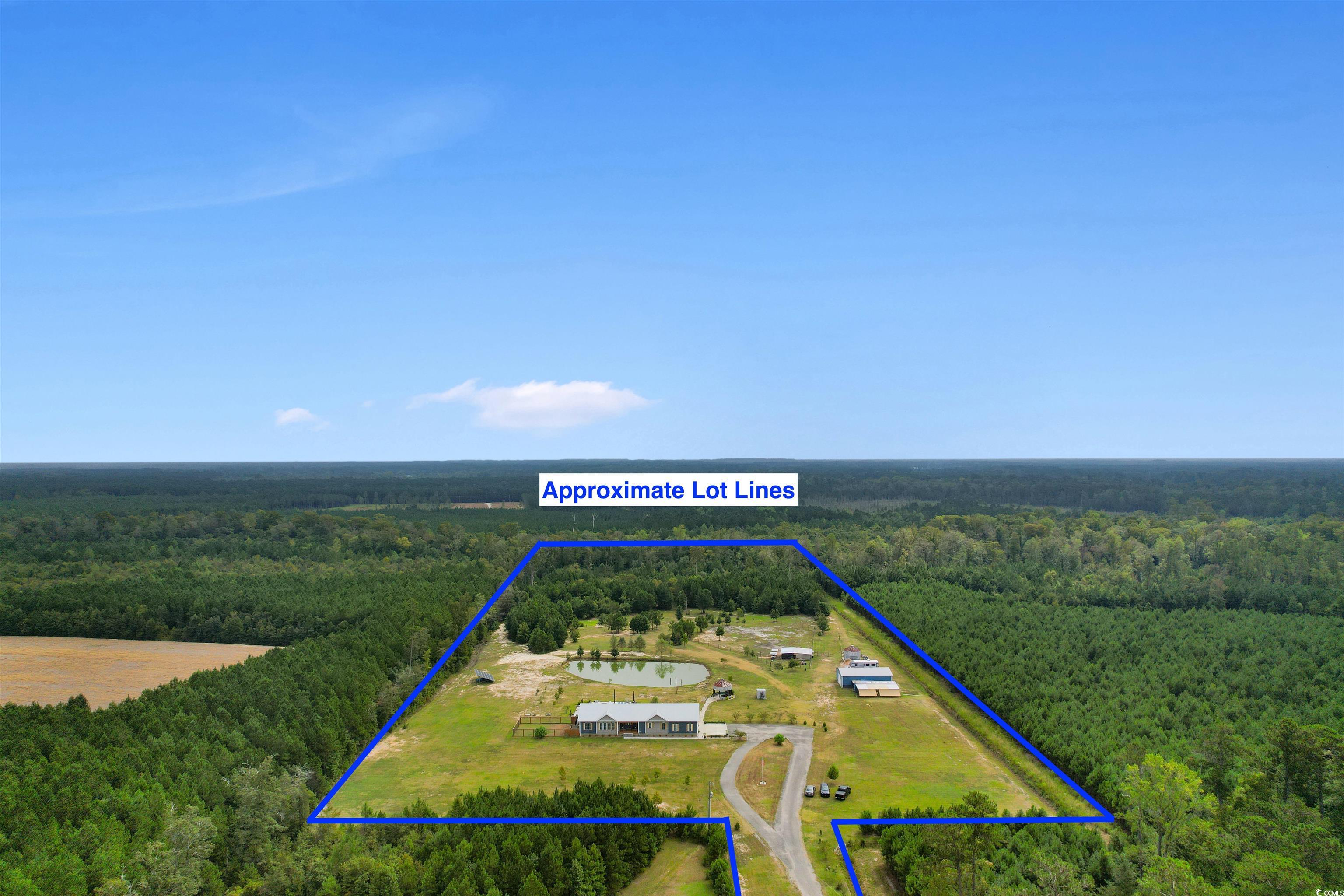 2901 Gause Road Loris, SC 29569 - Photo 36 of 37 View of patio / terrace with a fire pit