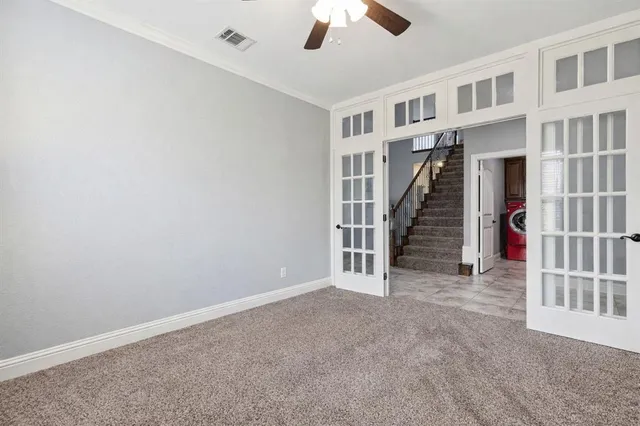 a bedroom with a large bed and a window