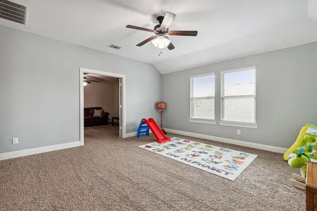 a room with furniture and pool table
