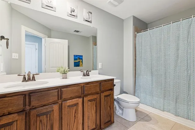 a living room with furniture fireplace and flat screen tv