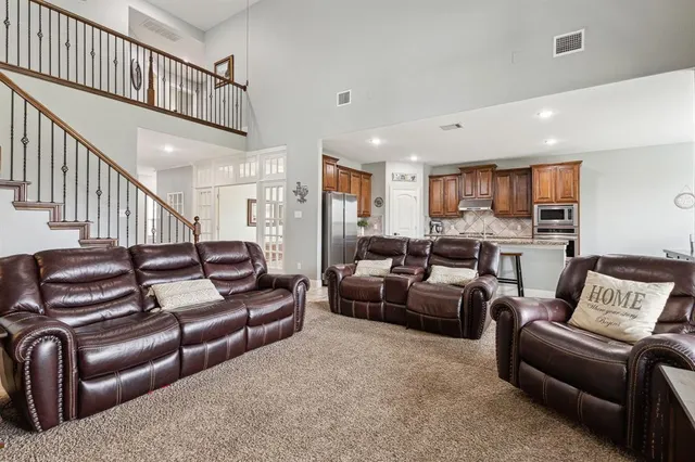 a living room with furniture or kitchen view and a wooden floor
