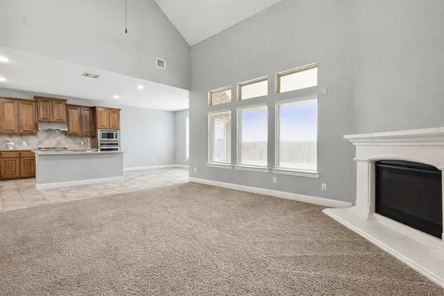 a view of a kitchen and a fireplace
