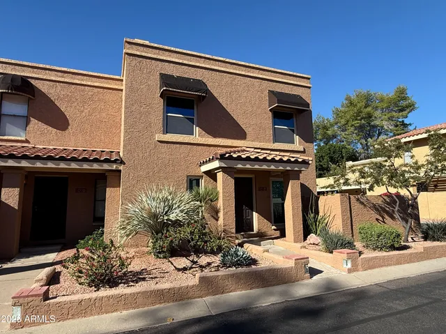 a front view of a house with garage