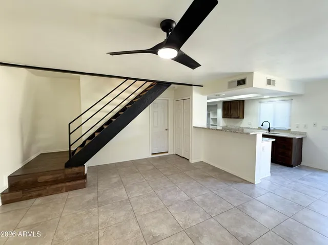 a view of kitchen with microwave and cabinets