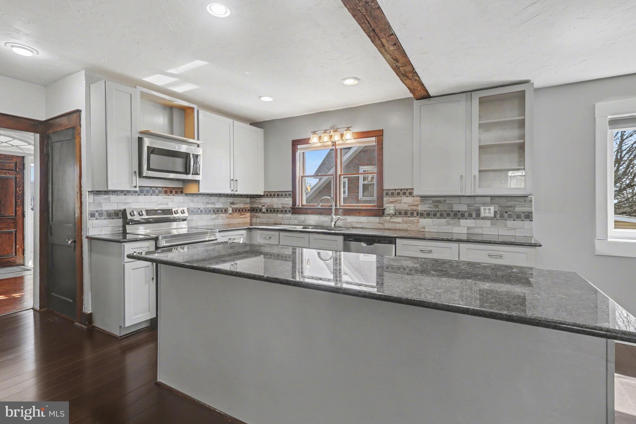 810 Copenhaffer Road York, PA 17404 - Photo 12 of 57 a kitchen with stainless steel appliances granite countertop a sink stove and microwave