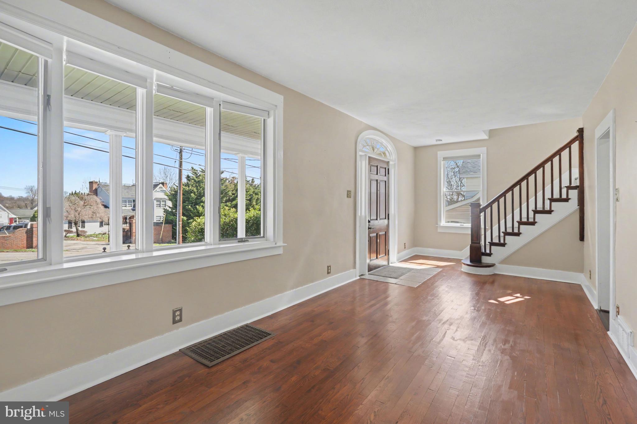 810 Copenhaffer Road York, PA 17404 - Photo 19 of 57 an empty room with wooden floor and windows