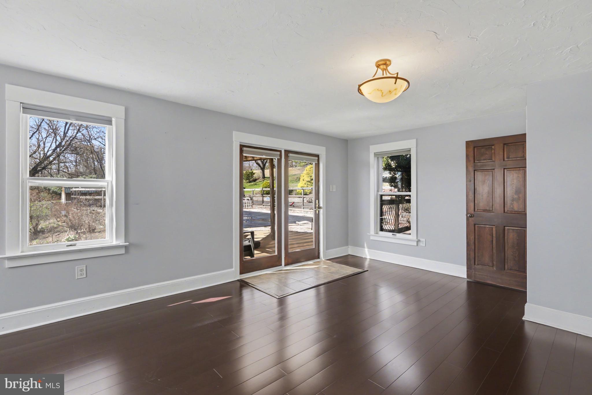 810 Copenhaffer Road York, PA 17404 - Photo 20 of 57 a view of an empty room with a window and wooden floor