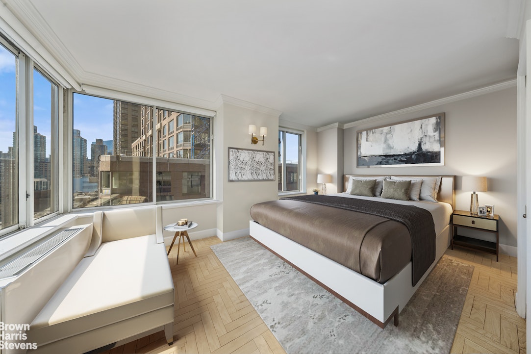 200 Riverside Boulevard, Unit 15I Manhattan, NY 10069 - Photo 14 of 23 a bedroom with a large bed and a large window