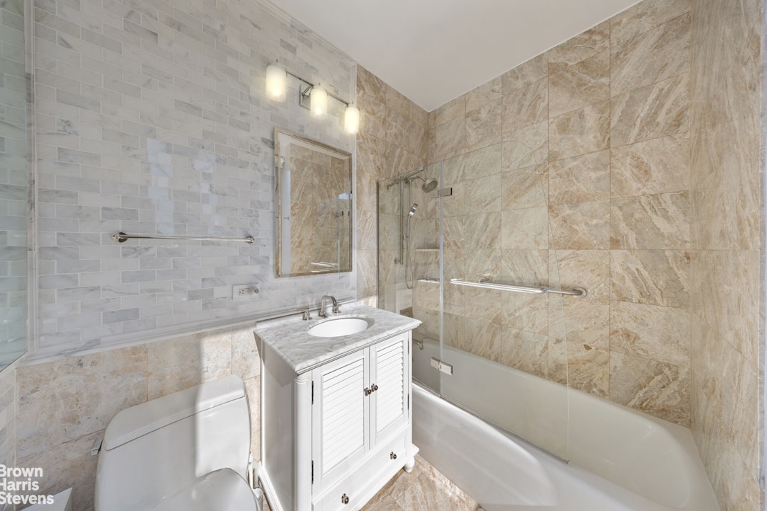 200 Riverside Boulevard, Unit 15I Manhattan, NY 10069 - Photo 15 of 23 a bathroom with a bathtub and a sink