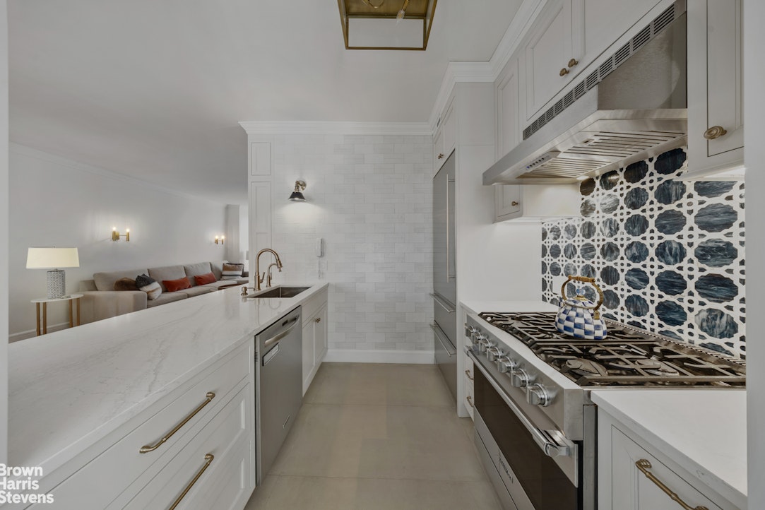 200 Riverside Boulevard, Unit 15I Manhattan, NY 10069 - Photo 2 of 23 a kitchen with stove and cabinets