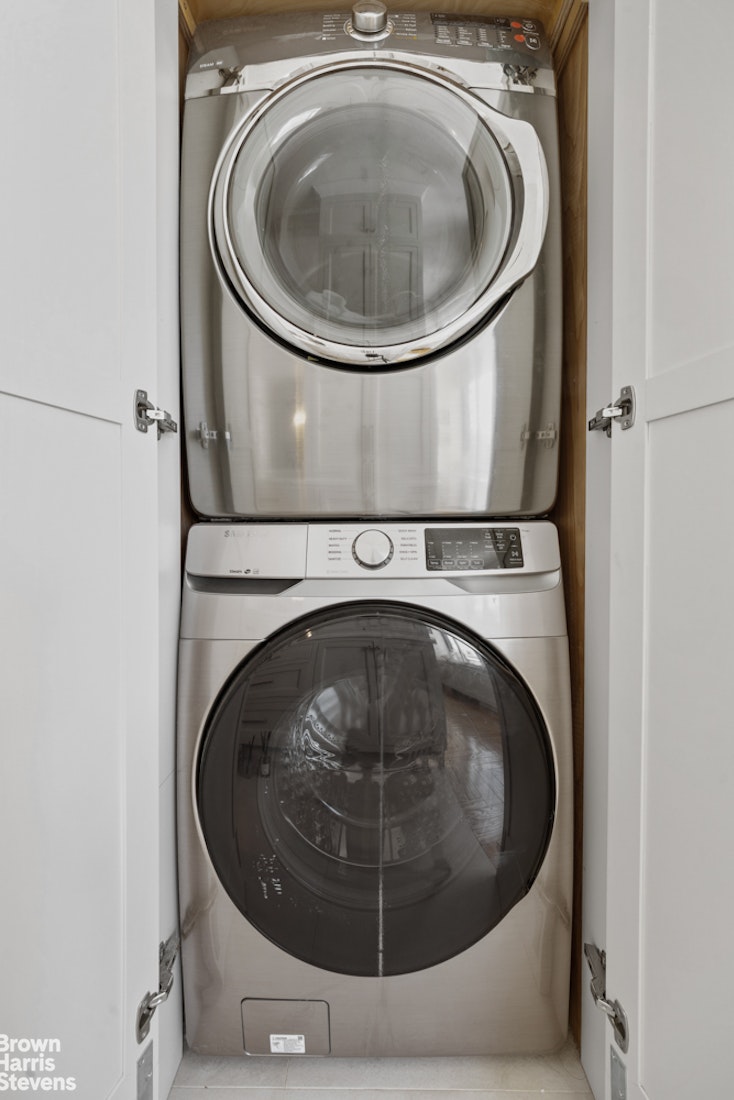 200 Riverside Boulevard, Unit 15I Manhattan, NY 10069 - Photo 3 of 23 a utility room with dryer and washer