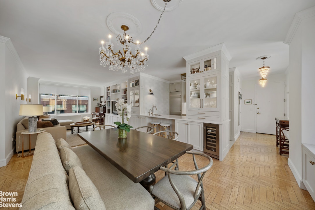 200 Riverside Boulevard, Unit 15I Manhattan, NY 10069 - Photo 4 of 23 a view of a dining room and livingroom with furniture wooden floor a chandelier