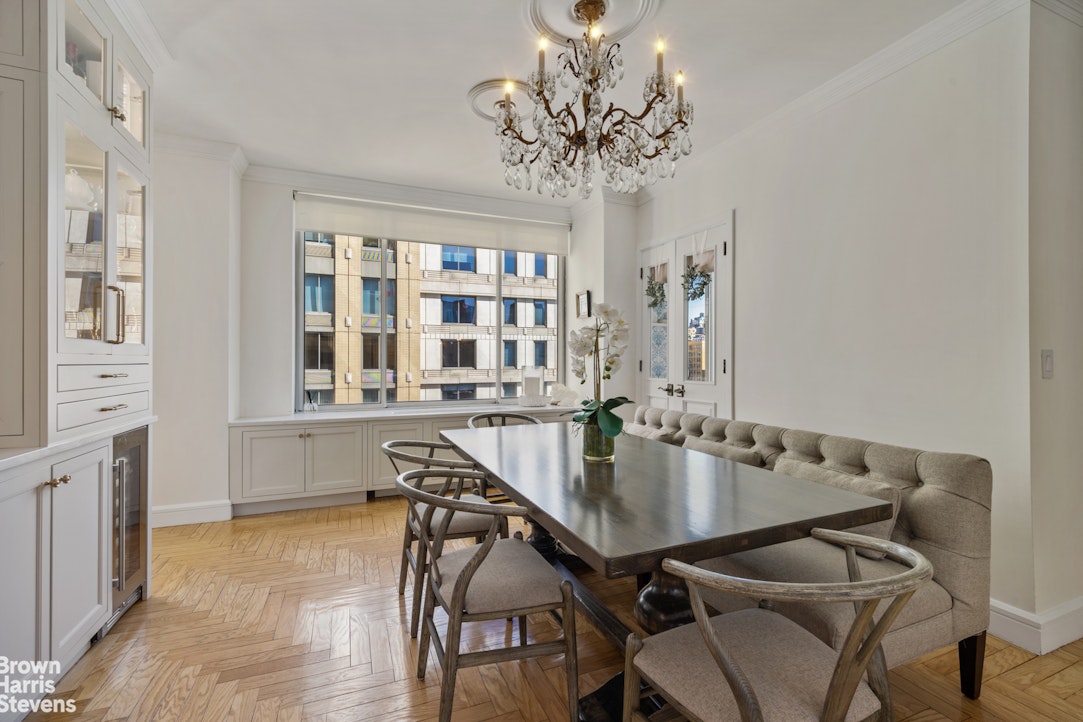 200 Riverside Boulevard, Unit 15I Manhattan, NY 10069 - Photo 7 of 23 a view of a dining room with furniture and chandelier