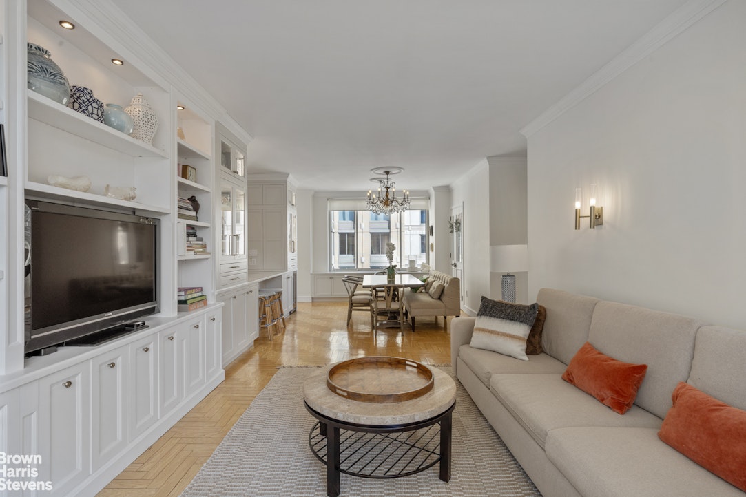 200 Riverside Boulevard, Unit 15I Manhattan, NY 10069 - Photo 8 of 23 a living room with furniture and a flat screen tv