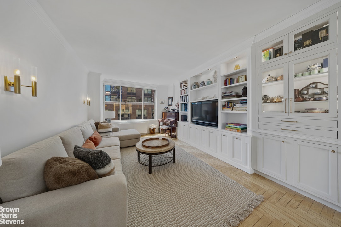200 Riverside Boulevard, Unit 15I Manhattan, NY 10069 - Photo 9 of 23 a living room with furniture and a flat screen tv
