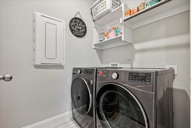 a utility room with dryer and washer