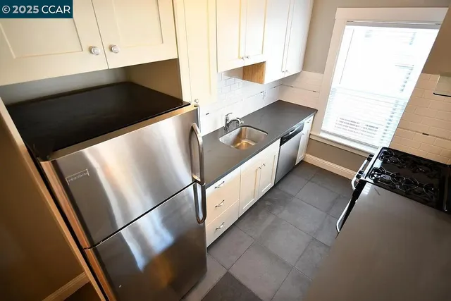 a view of an empty room and a window