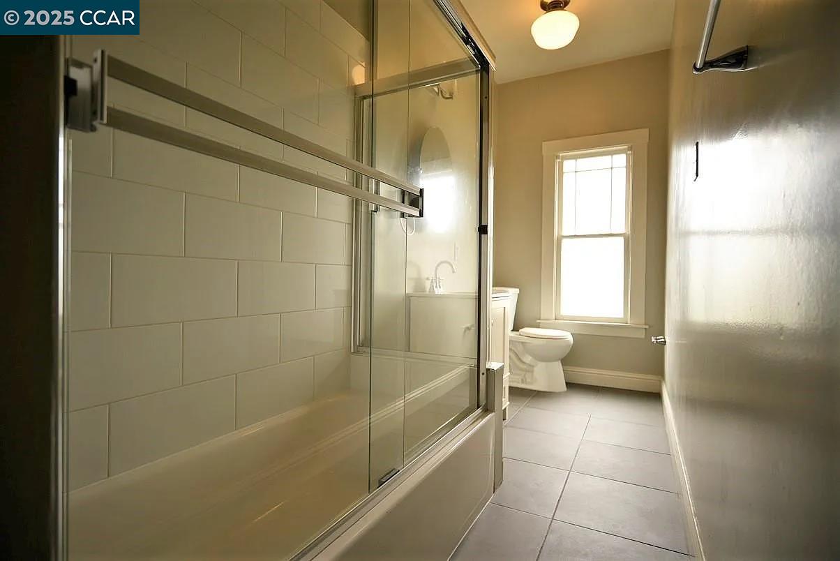 3040 Telegraph Avenue, Unit 6 Berkeley, CA 94705 - Photo 8 of 9 a bathroom with a bathtub and a shower