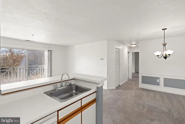 a kitchen that has a sink and a window