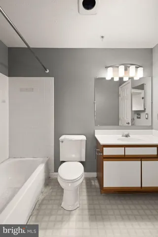 a bathroom with a toilet a sink and a bathtub