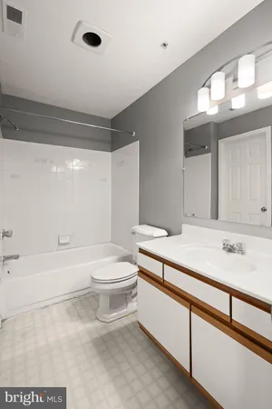 a bathroom with a sink a toilet and a bathtub