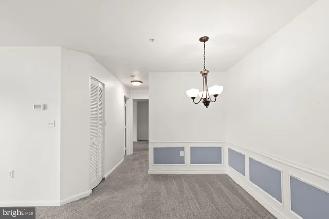 a view of a hallway with an empty room