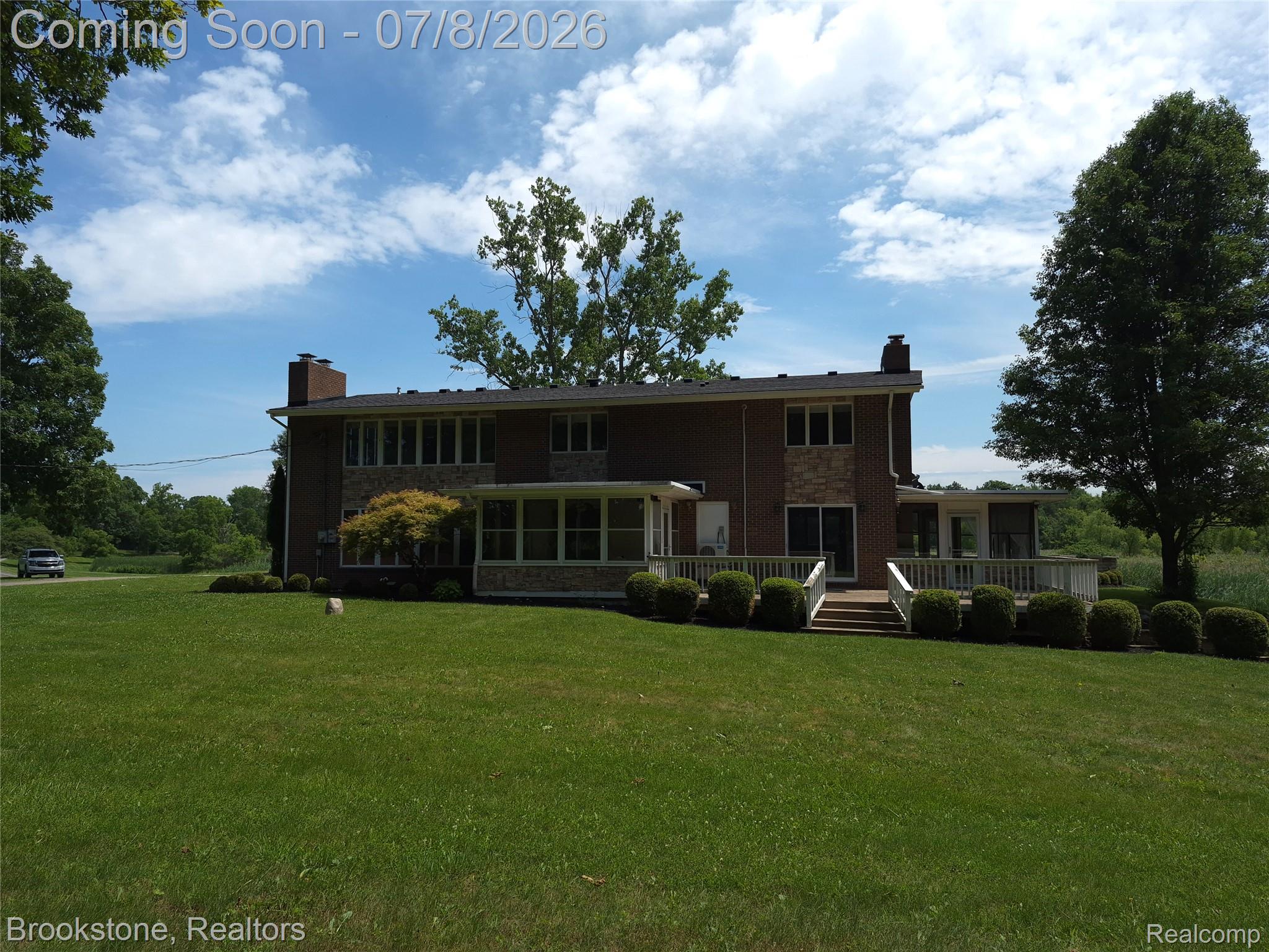 4140 South Henderson Road Davison, MI 48423 - Photo 92 of 98 Brick exterior with multiple windows and two chimneys