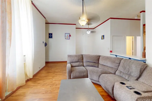 a living room with furniture and a chandelier