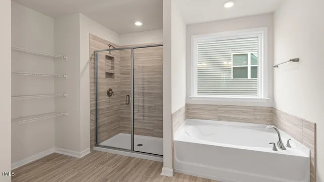 a bathroom with a double vanity sink and mirror