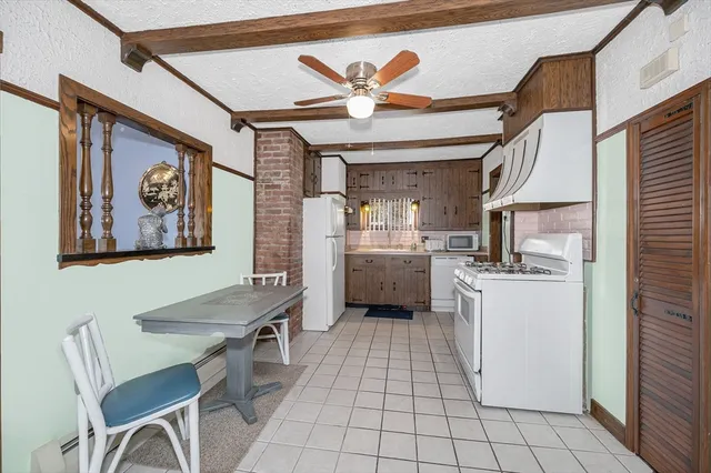 a kitchen with a cabinets and appliances