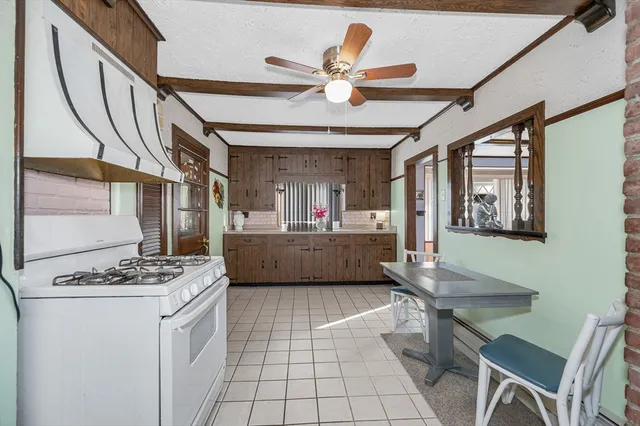 a kitchen with a table and chairs